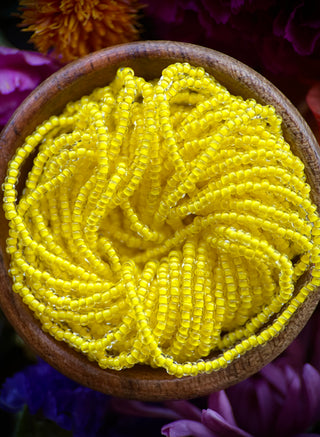 Size 11/0 Czech Glass- #1556 Crystal Intense Yellow Lined